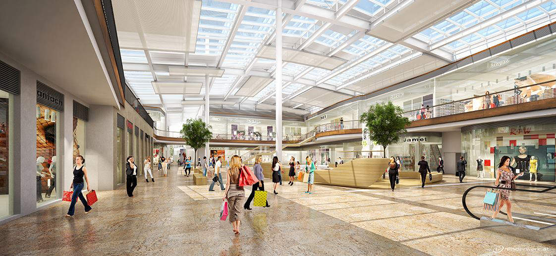 Ein geräumiges Einkaufszentrum mit hoher Glasdecke, natürlichem Licht und modernem Design. Käufer tragen Taschen, während sie über glänzende Böden laufen. Grünpflanzen schmücken den offenen Bereich und verschiedene Ladenfronten sind sichtbar.