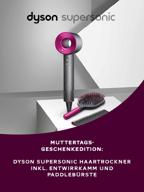 Présentation du sèche-cheveux Dyson Supersonic sur un support avec un anneau intérieur rose, accompagné d'un peigne démêloir et d'une brosse plate. Le texte allemand indique une édition spéciale pour les cadeaux de la fête des mères.