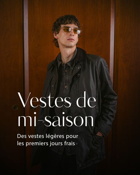 Un homme avec des lunettes de soleil et une veste sombre se tient devant des portes en bois. Un texte français fait la promotion de vestes légères pour la mi-saison.