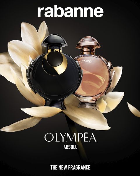 Deux flacons du parfum Rabanne Olympéa ABSOLU, un noir et un rose, sont présentés devant une fleur blanche épanouie sur un fond sombre. Le texte indique : « Rabanne OLYMPÉA ABSOLU - LE NOUVEAU PARFUM. ».