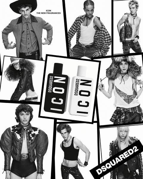 Un homme en costume croisé noir et cravate grise se tient avec assurance devant une œuvre d'art abstraite. À côté de lui, sur une surface en bois, se trouve une lampe noire avec des accents en laiton. L'ambiance est moderne et élégante.