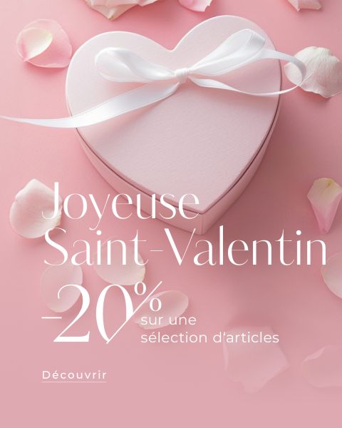 Boîte cadeau en forme de cœur avec ruban blanc, pétales de rose roses et texte français avec 20 % de réduction sur certains articles pour la Saint-Valentin.