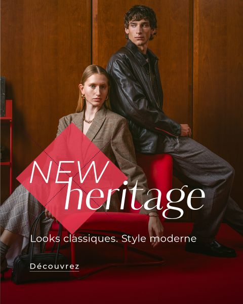 Deux mannequins en tenue de ville moderne posent sur des chaises rouges devant un fond en bois. Le texte dit : « NOUVEL héritage. Looks classiques. Style moderne. Découvrez… ».