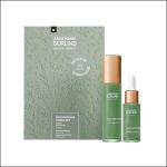 Green Annemarie Börlind Natural Beauty NatuRoyale Hautpflegeset mit einem Serum, einer Tropfflasche mit Gesichtsöl und einer dekorativen Schachtel vor weißem Hintergrund.
