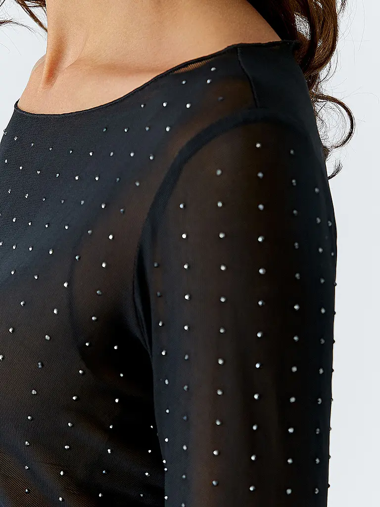 OUÍ | Nom du produit : T-shirt à manches longues
Marque : OUÍ
Couleur : noir
Catégories : Mode,Femme

Longueur des manches : Manches longues
Encolure : Encolure bateau
Matière : Jersey,Polyester / Polyamide,Stretch
Motif : Uni
Coupe (vêtements d'extérieur | Noir