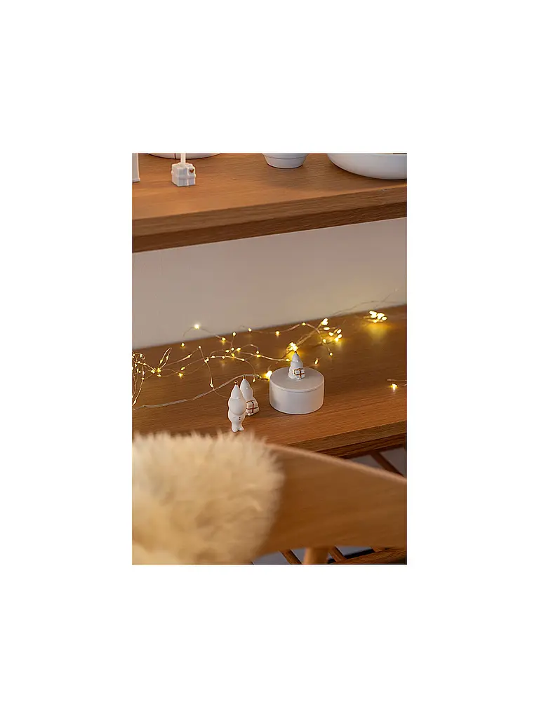RAEDER | Figurine de Noël en porcelaine, Père Noël emballant des cadeaux | Blanc